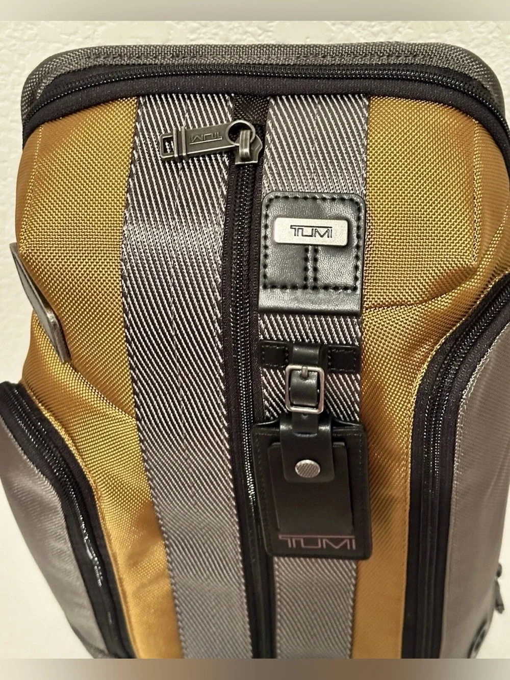 Brand New with Tag TUMI Higgins Sling Golden Brown Gray